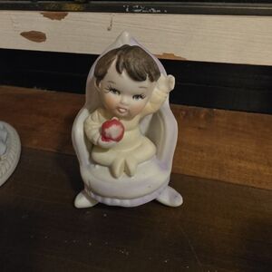 Adorable Ceramic Figurine with Flower